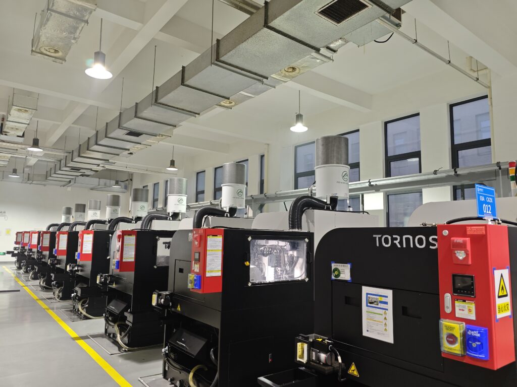 Oil Mist Collectors on a TORNOS Swiss-Type CNC Lathe Production Line